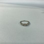 A platinum three stone diamond ring, 4.8g, size 'M'