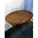 A walnut oval occasional table