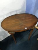 A walnut oval occasional table