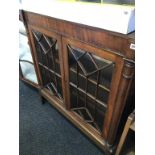 A Continental mahogany glazed bookcase