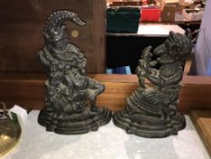 A pair of cast iron Punch and Judy door stops