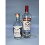 A bottle of 'Hrafn Gin' and a bottle of Smirnoff vodka