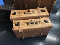 Two matching leather suitcases