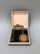 A full sovereign, dated 1904, mounted in 9ct gold, with a 9ct gold chain, weight 21g