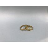 An 18ct gold ring, weight 3g and one other, weight 4.4g