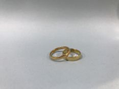 An 18ct gold ring, weight 3g and one other, weight 4.4g