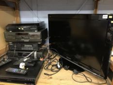 A TV, a quantity of Technics hifi and a DVD player