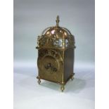 A brass cased lantern clock with eight day movement, 35cm height