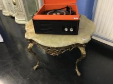 An onyx and heavy brass table