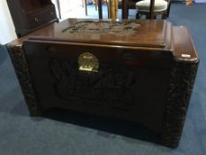 A carved camphorwood Oriental chest