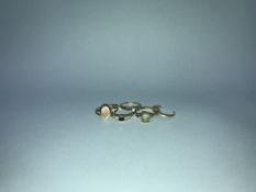 Two 18ct gold rings, weight 2.5g and two 9ct gold rings, weight 4.7g, and one other