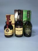 A bottle of Croft Original, a bottle of Mount Gay rum, and a bottle of Gran Duque D 'Alba