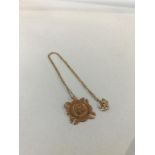 A 9ct gold medallion and chain, weight 8g