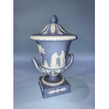 A Wedgewood blue Jasperware two handled vase and cover