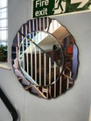 A decorative circular two colour mirror, 57cm diameter