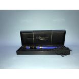 A boxed Yves Saint Laurent pen