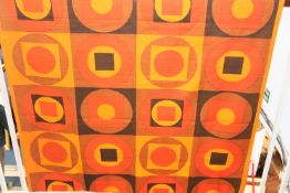 A piece of fabric with orange and brown geometric circles and squares, 118cm x 190cm long