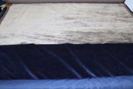 A roll of midnight blue velvet fabric, 155cm wide x 6m 60cm long, a roll of cashmere colour plain