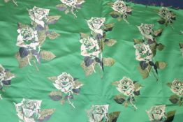 A piece of furnishing fabric, vibrant green ground with roses pattern, 127cm wide x 4.5m long