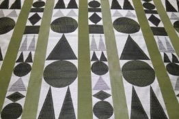 A roll of green fabric with topiary tree design, 129cm wide x 5m long