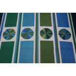 A piece of cotton fabric for Edinburgh Weavers, blue and green geometric pattern, 123cm wide x 123cm