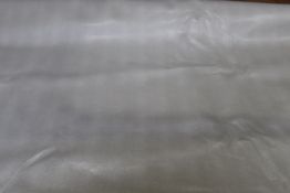 A roll of faux leather light brown embossed furnishing fabric, 136cm x 2m 85cm, a cream beige