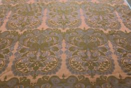 A roll of sateen finish vibrant orange, blue and green floral design fabric. 127cm wide x 20