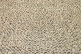 An unpatterned roll of boucle fabric in caramel and black. 115cm wide x 2 metres 54cm