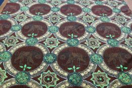 A roll of sateen fabric decorated with Lions, highlighted with vibrant green and yellow. 134cm