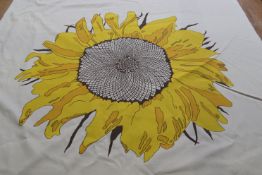 A roll of cream fabric with oversized Sunflower head design, 124cm wide x 10m plus long