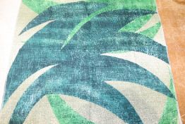 Five bales of Edinburgh Weavers fabric, "Kalabu", 1950s to 1960s, in green leaf design and brown and