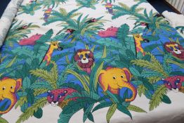 A roll of Jungle patterned fabric, elephants, lions, monkeys, parrots etc., 215cm wide x 14m long (