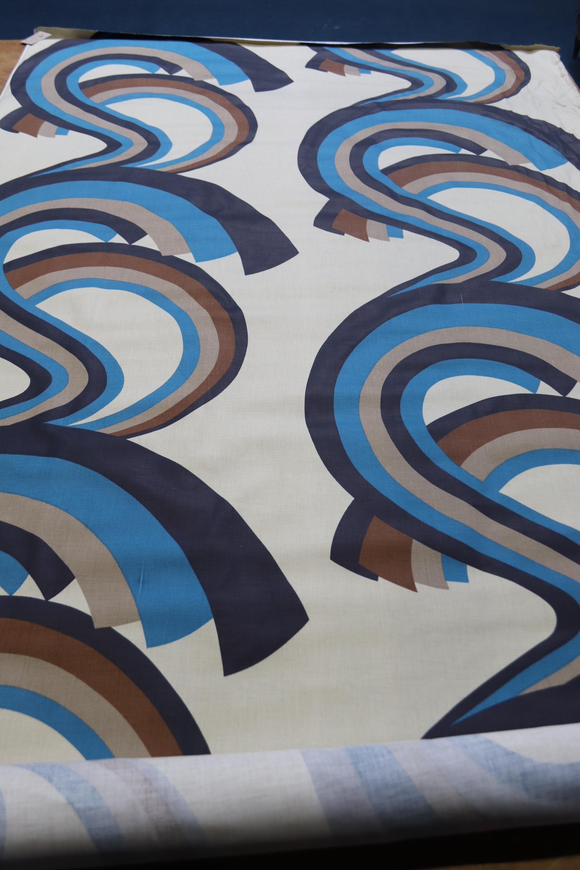 A roll of cream fabric with blue and brown geometric pattern, 122cm wide x 5m long