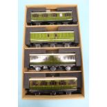 Two boxed sets of three Darstaed Southern railway coaches (one set with six wheels) (6)