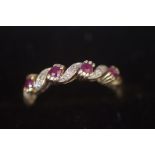 9ct Gold ring set with rubies & diamonds
