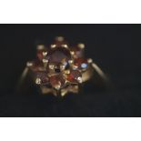 9ct Gold ring set with 9 garnets