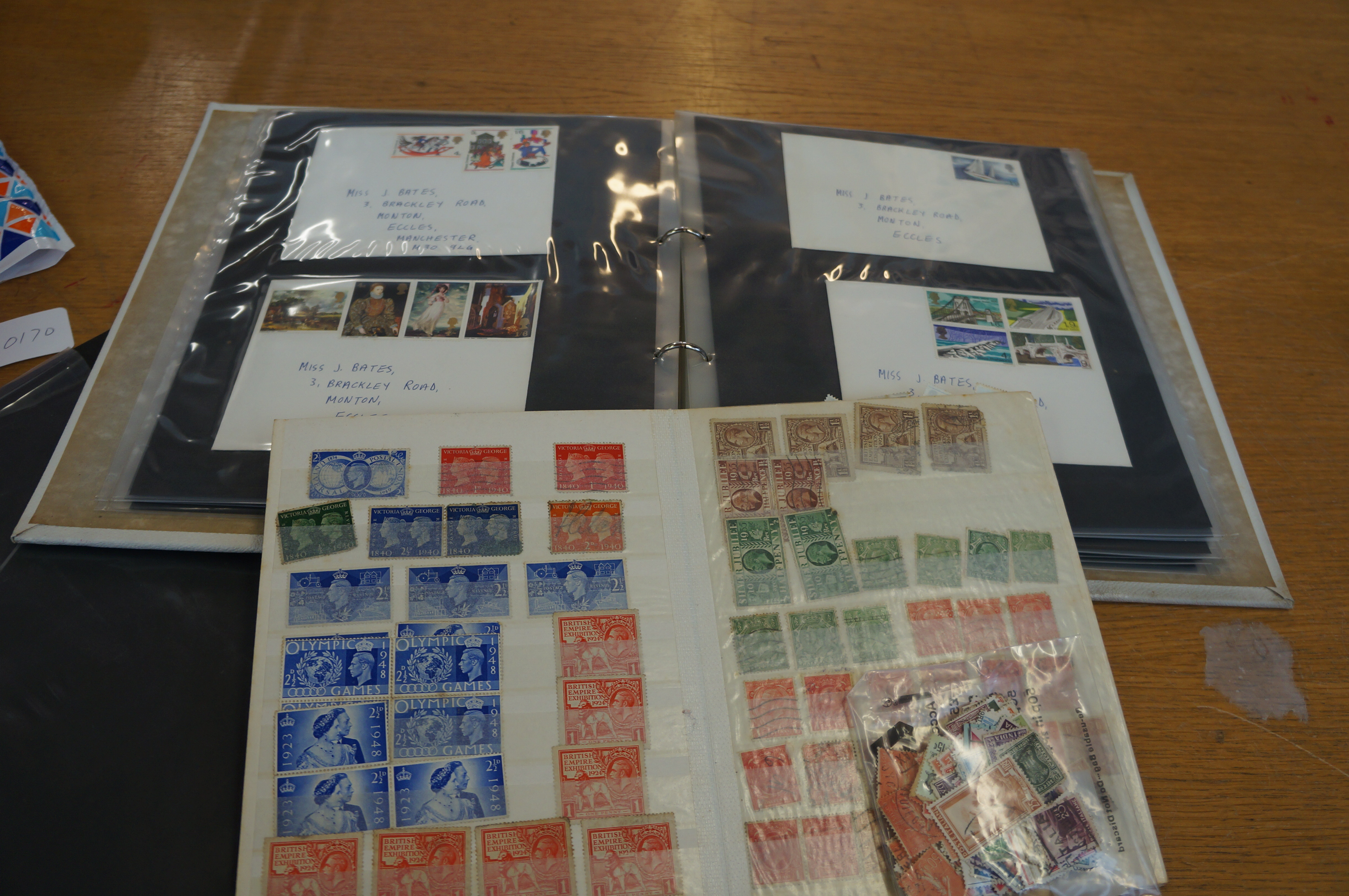Small stamp album of British stamps together with