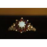 9ct Gold ring set with Opal & red stones