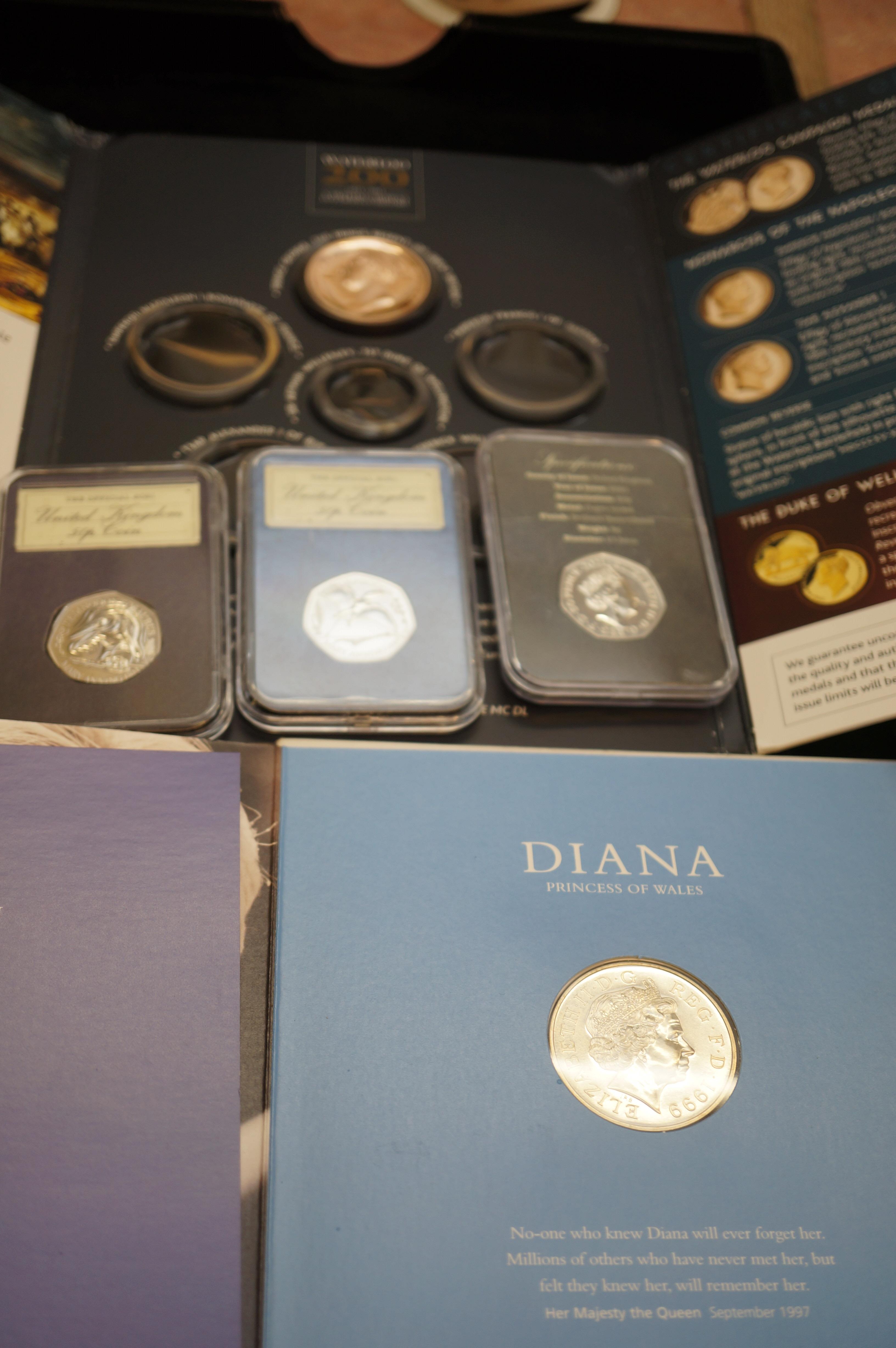 3x British 50p coins together with a Diana crown p