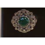 Silver ring set with green stone