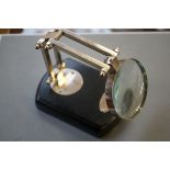 Magnifying glass on wooden base