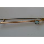 9ct Gold pin brooch set with blue gem stone