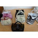 Collection of 6 glass handbags