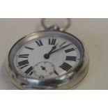 Silver pocket watch currently ticking