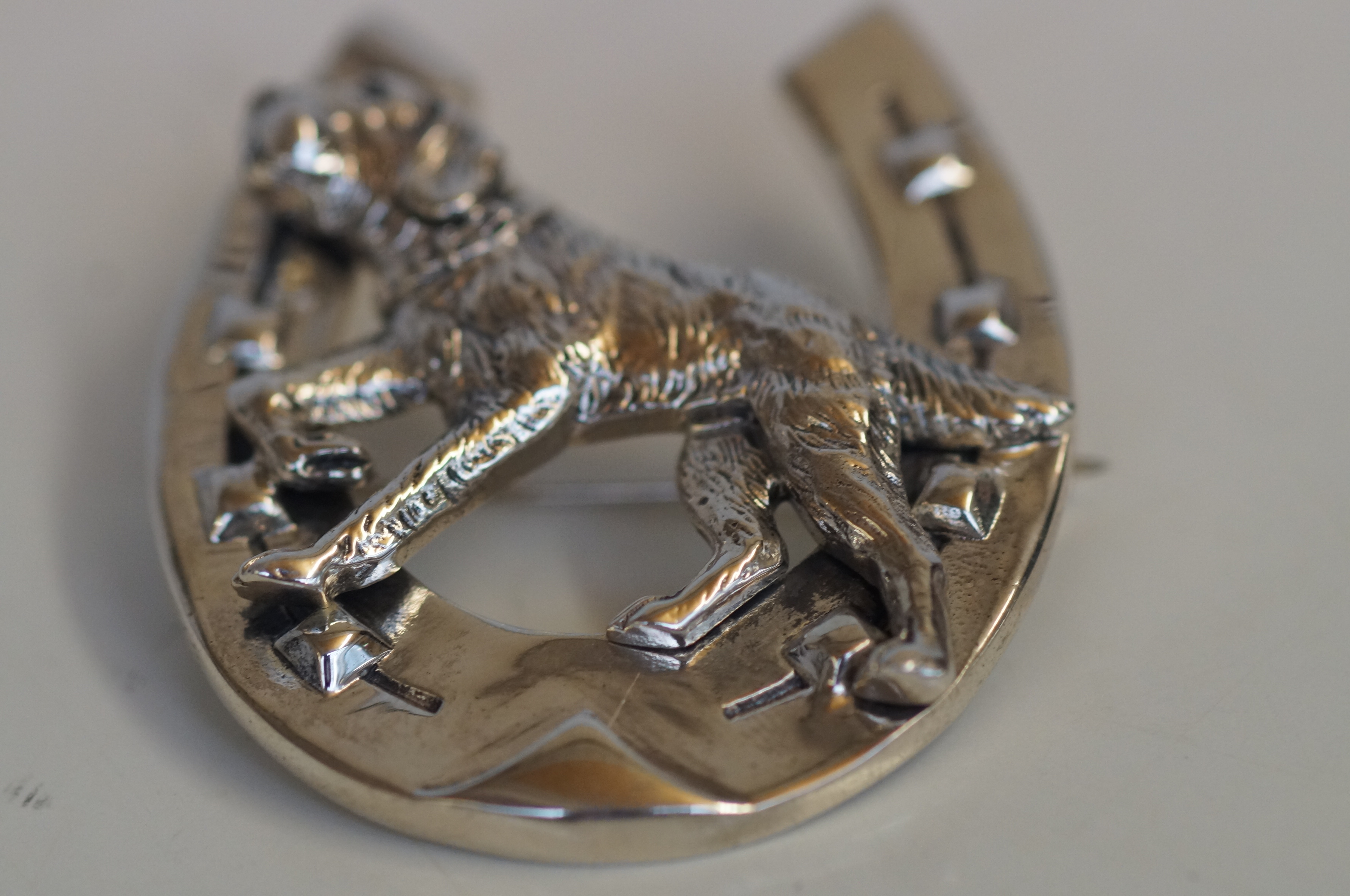 Silver large hunting dog in horse shoe brooch