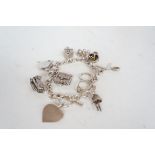 Silver charm bracelet (10 charms )