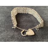 Silver gate bracelet with safety chain & heart sha