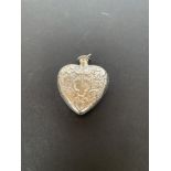 Silver heart shaped perfume bottle