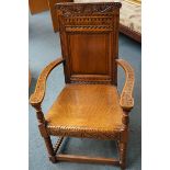 Solid oak wide carved arm chair
