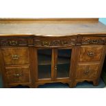 An early 20th century side board walnut veneered f